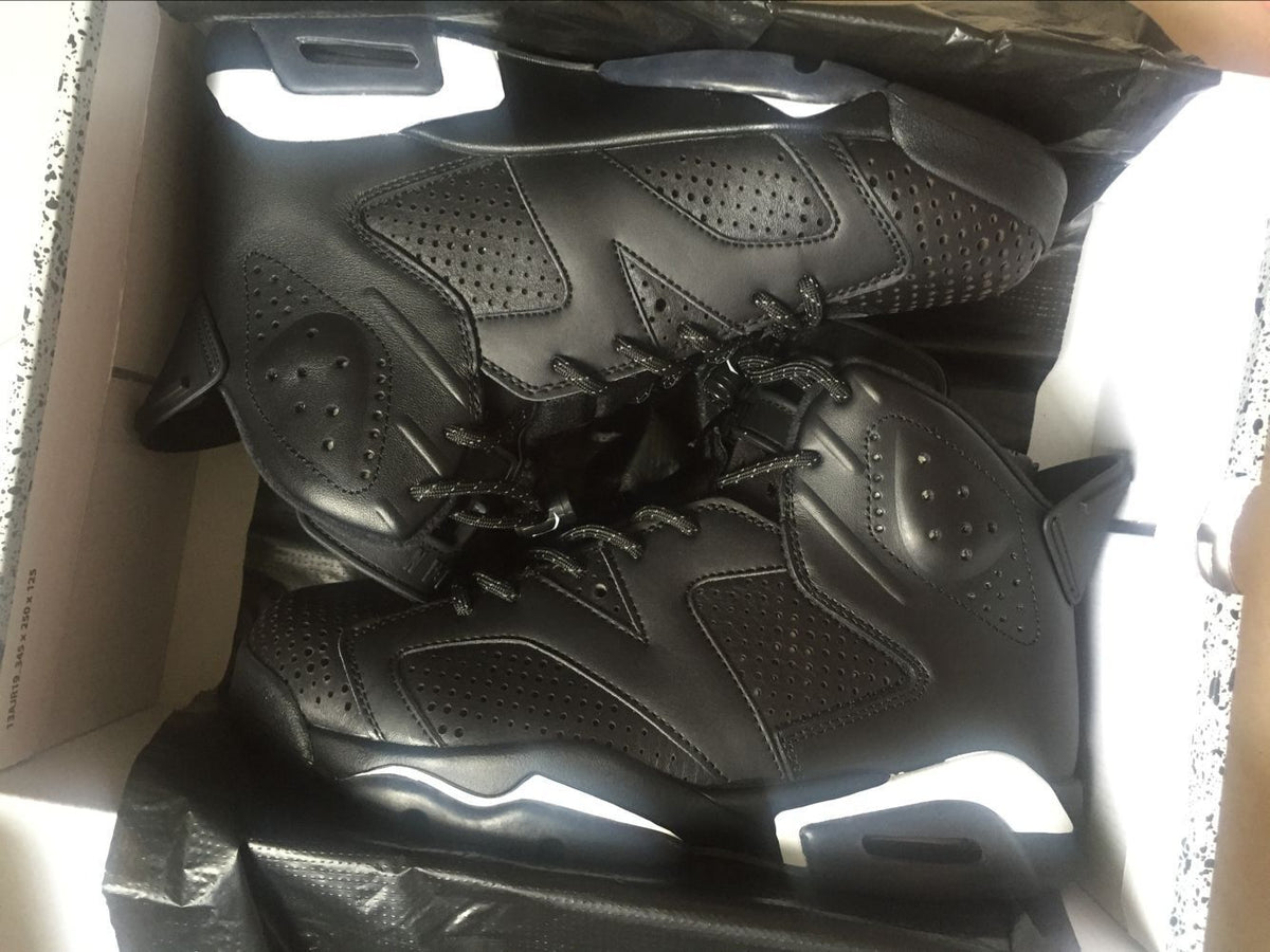 Jordan 6 Retro Black Cat High-Top Sneakers in Black and White - product image from the listing.