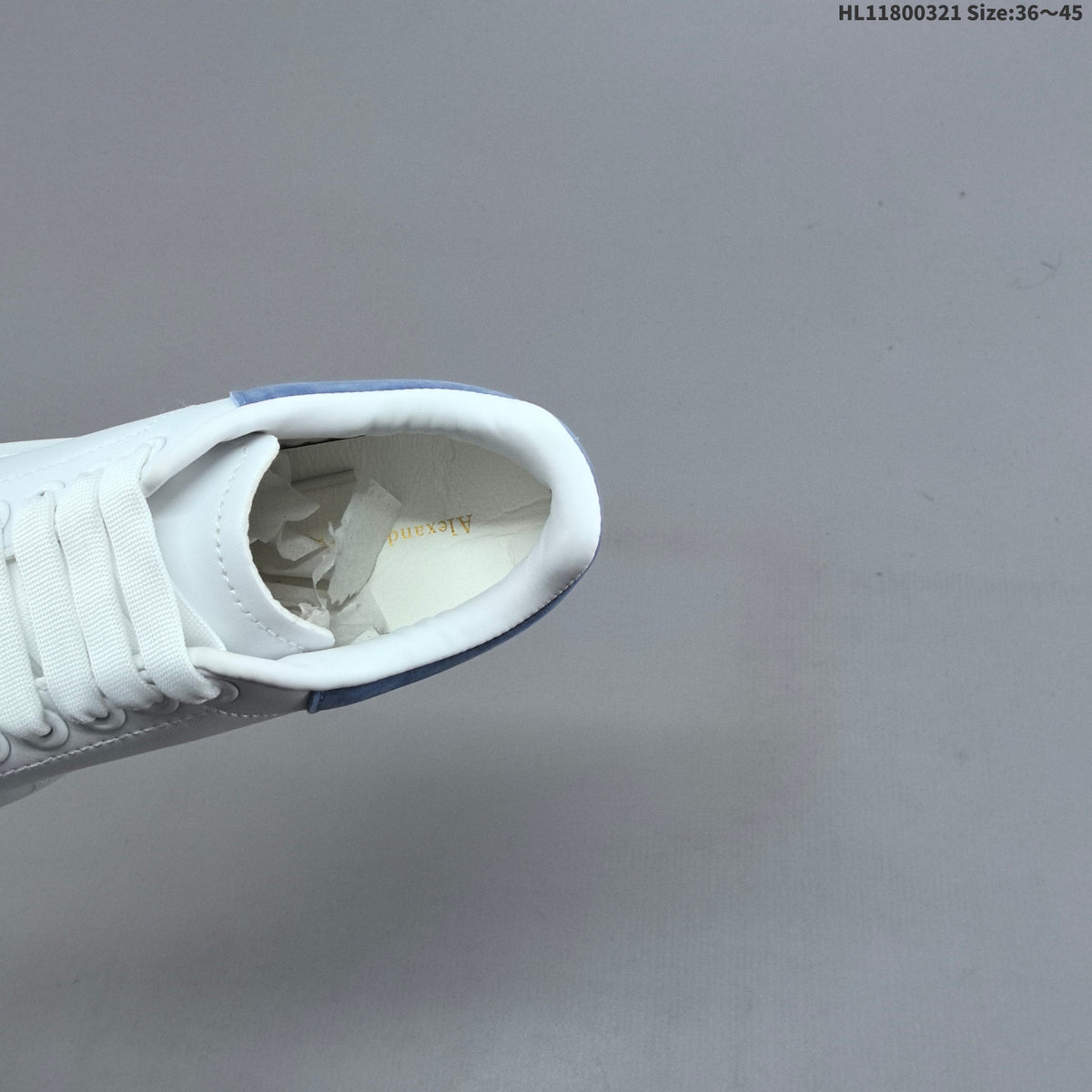 Alexander McQueen Oversized Low-Top Sneakers, in White and Blue - product image from the listing.