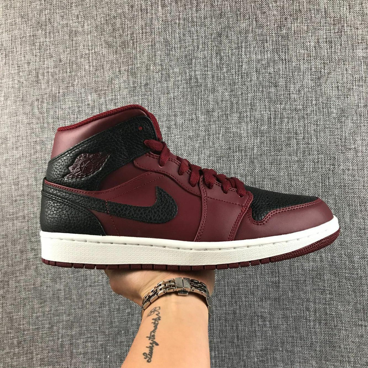 Air Jordan 1 Mid Sneakers in Black and Burgundy 554724-601 - product image from the listing.