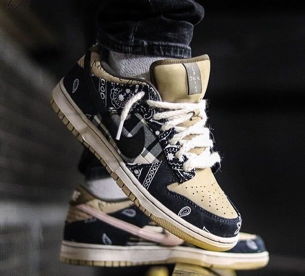 Black and Tan Jordan 1 High Paisley Pattern Sneakers - product image from the listing.