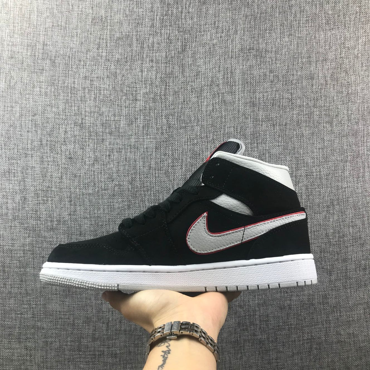 Air Jordan 1 Mid Black, Sneakers in White & Red 554724-060 - product image from the listing.