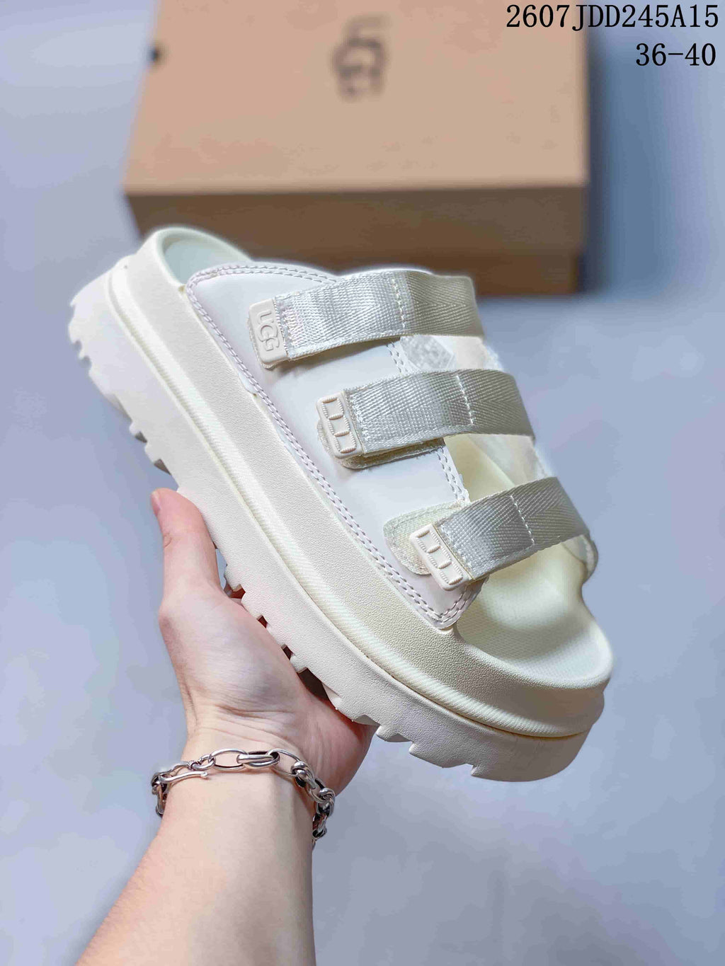 White UGG GoldenGlow Slide Sandals - product image from the listing.