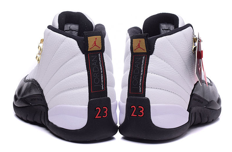 Air Jordan 12 Retro White and Black High-Top Sneakers - product image from the listing.