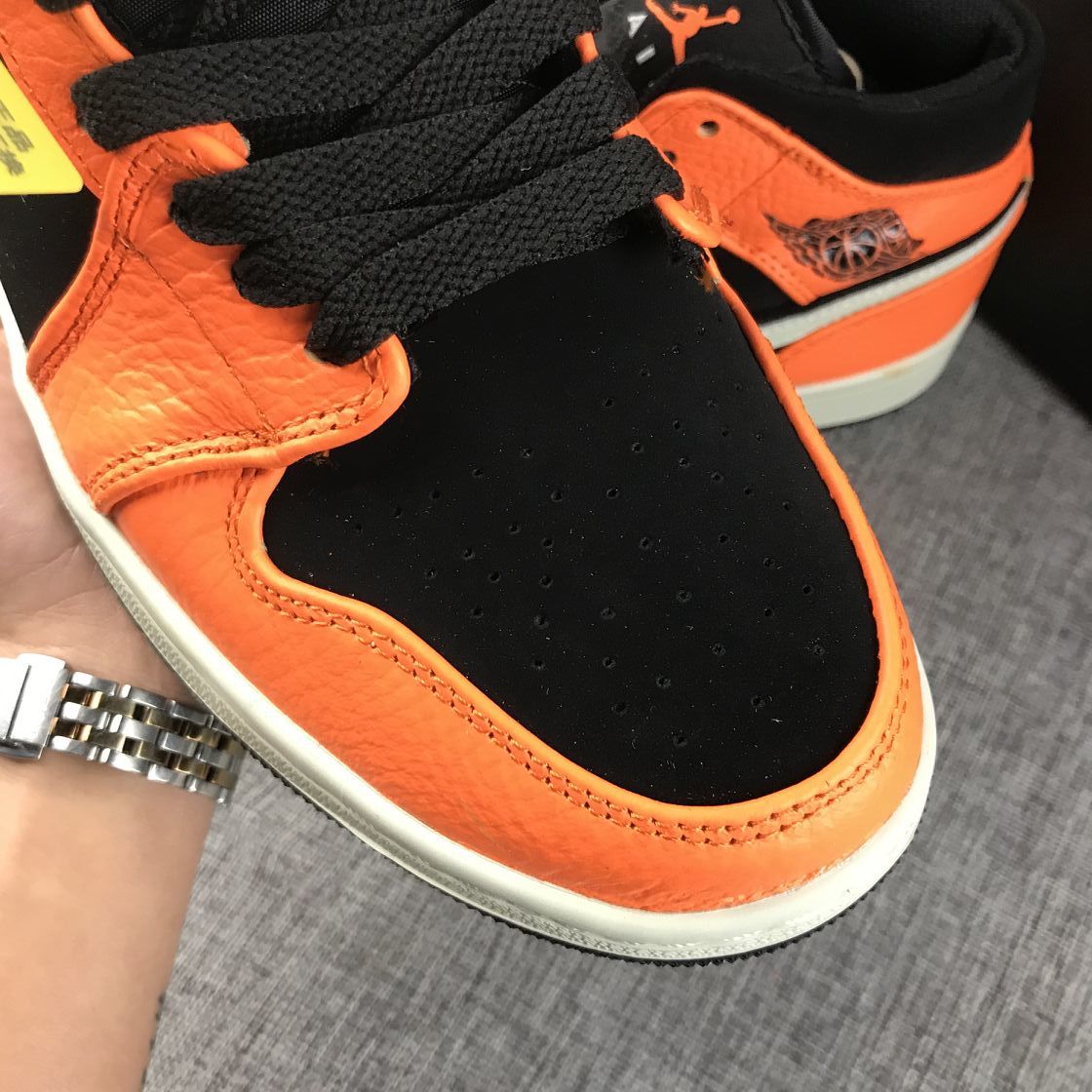 Air Jordan 1 Mid Shattered Backboard Sneakers, in Black and Orange - product image from the listing.