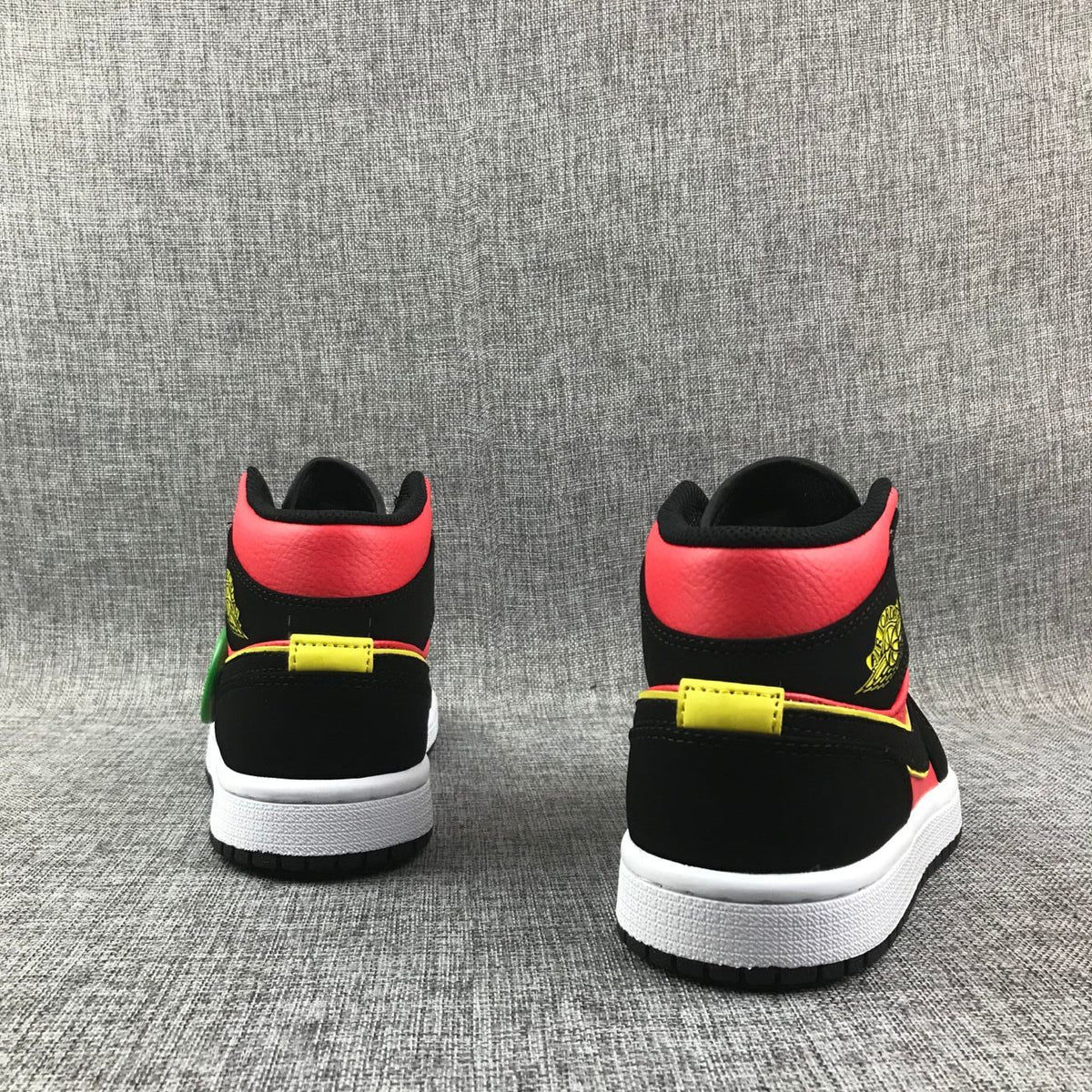Air Jordan 1 Mid Black, Sneakers in Red and Volt - product image from the listing.