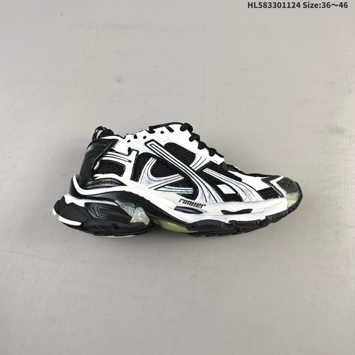 Black and White Balenciaga Runner Low-Top Sneakers - product image from the listing.