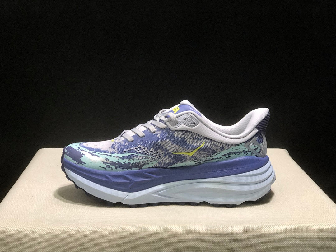 Purple and Mint HOKA Stinson 7 Running Shoes - product image from the listing.