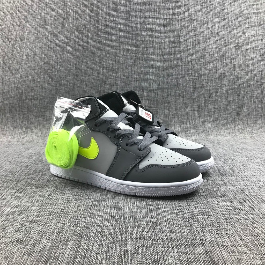 Air Jordan 1 Mid Sneakers in Grey Volt 554724-072 - product image from the listing.