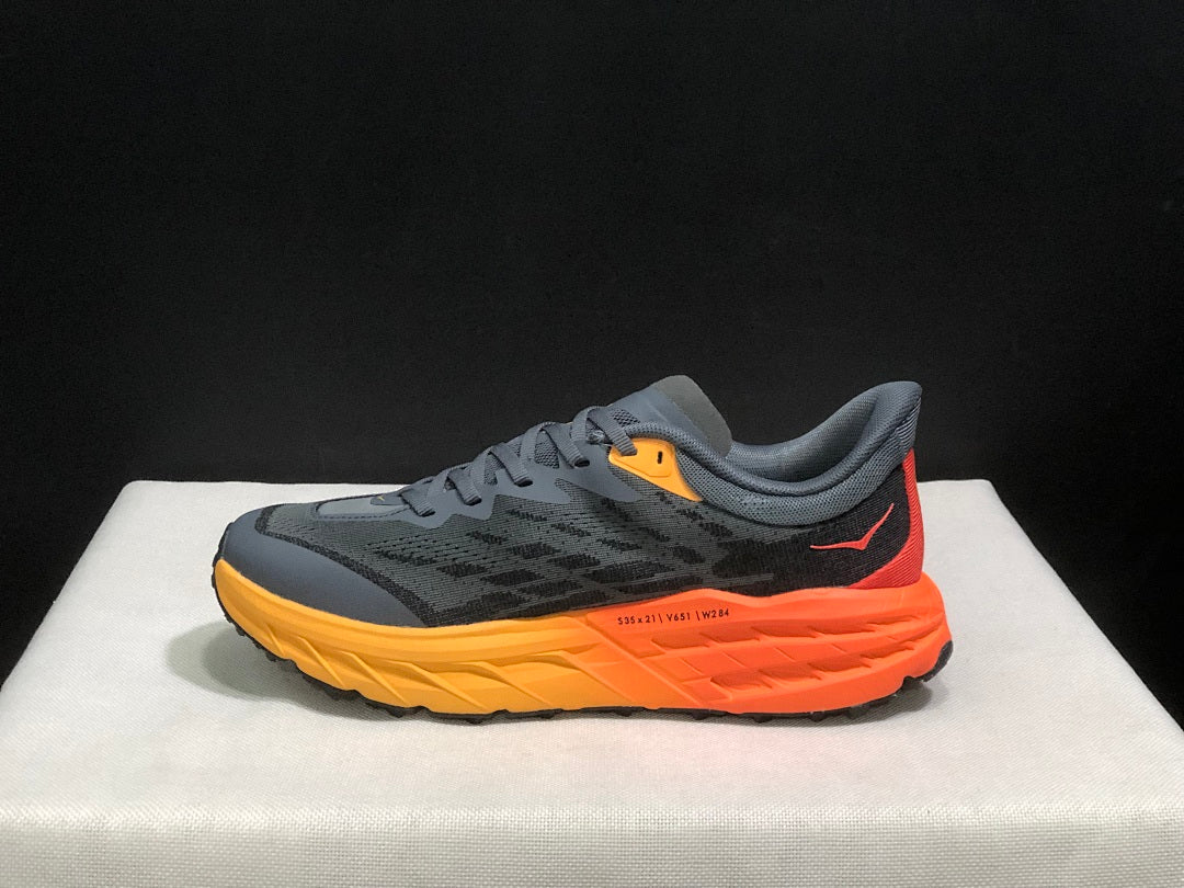 HOKA Speedgoat 5 Trail Running Shoes, in Gray and Orange - product image from the listing.