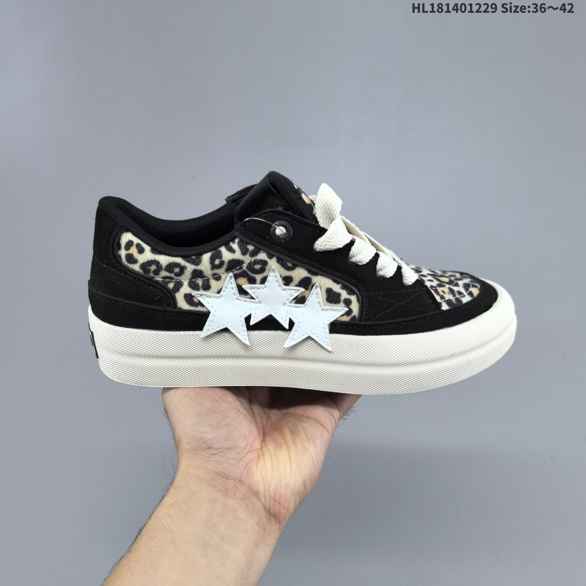 AMIRI Star Low-Cut Sneakers with Leopard Print Details - product image from the listing.