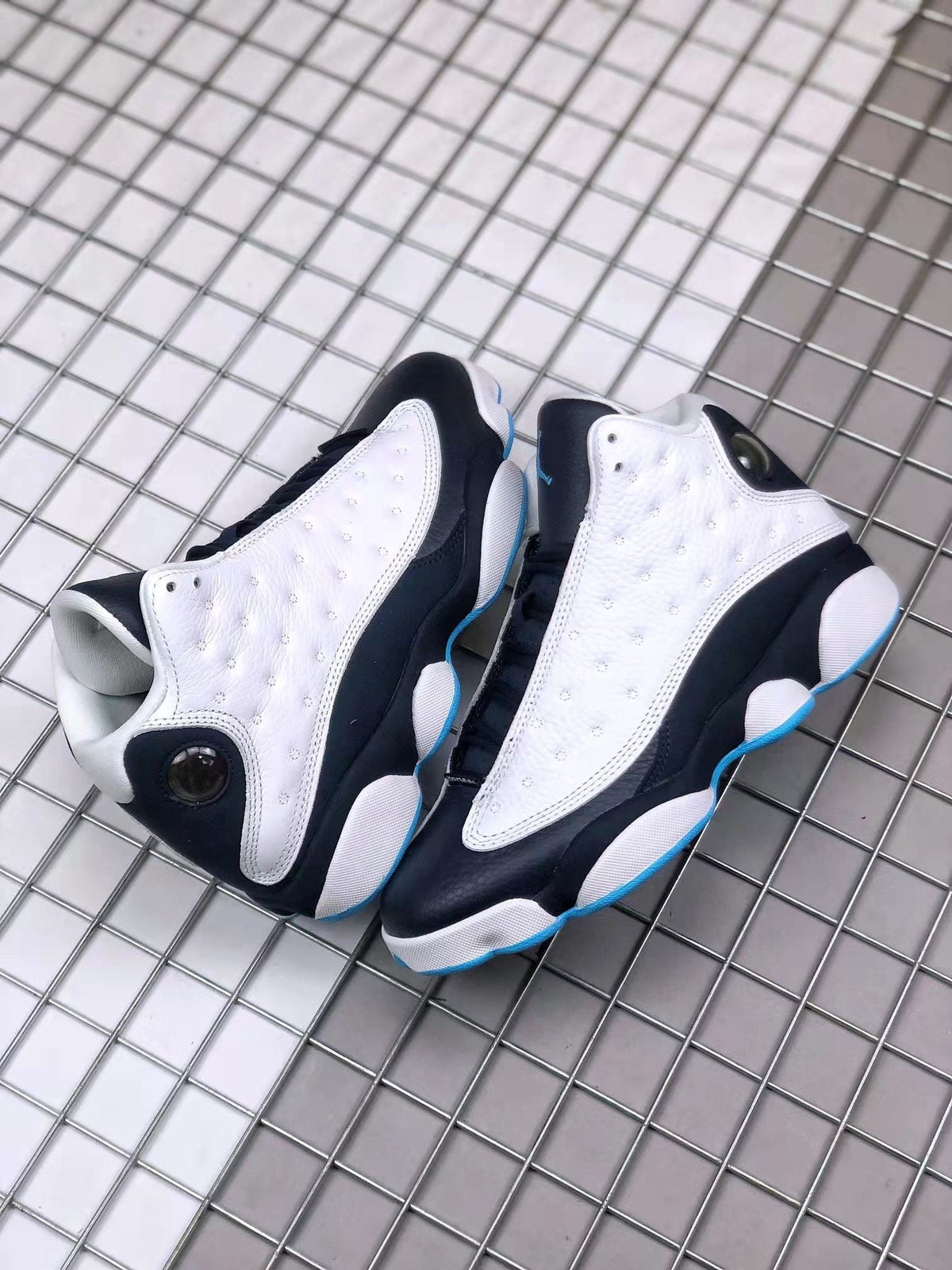 Air Jordan 13 Obsidian Sneakers 414571-144 - product image from the listing.