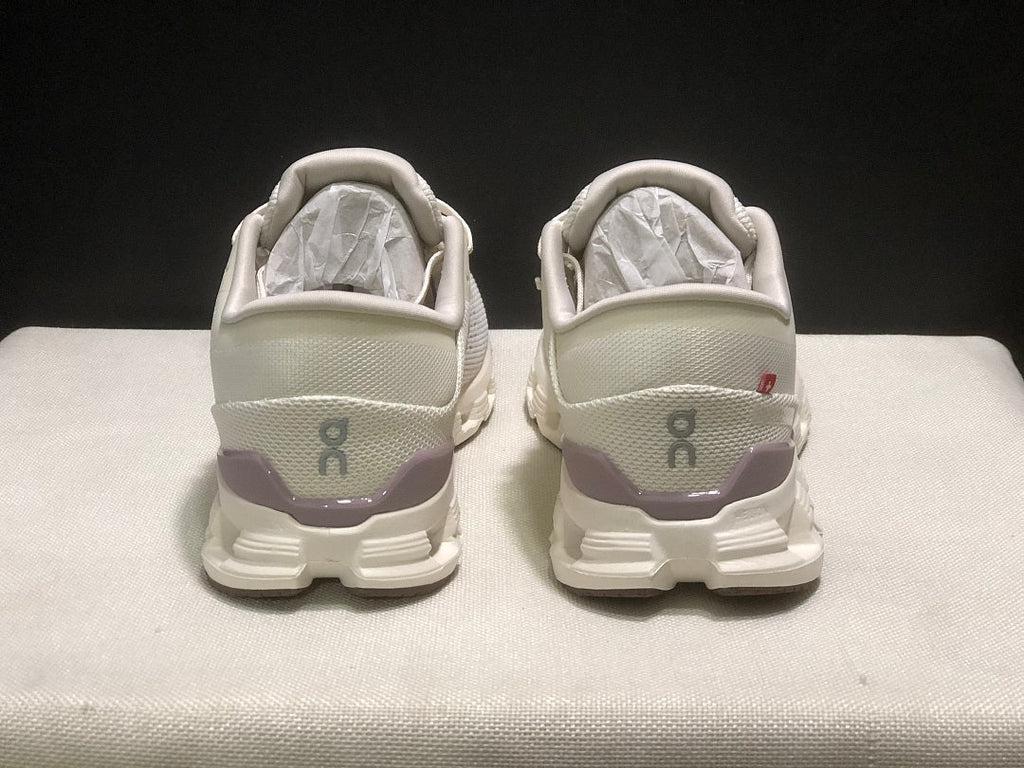 On Cloud X 4 Running Sneakers in Ivory - product image from the listing.