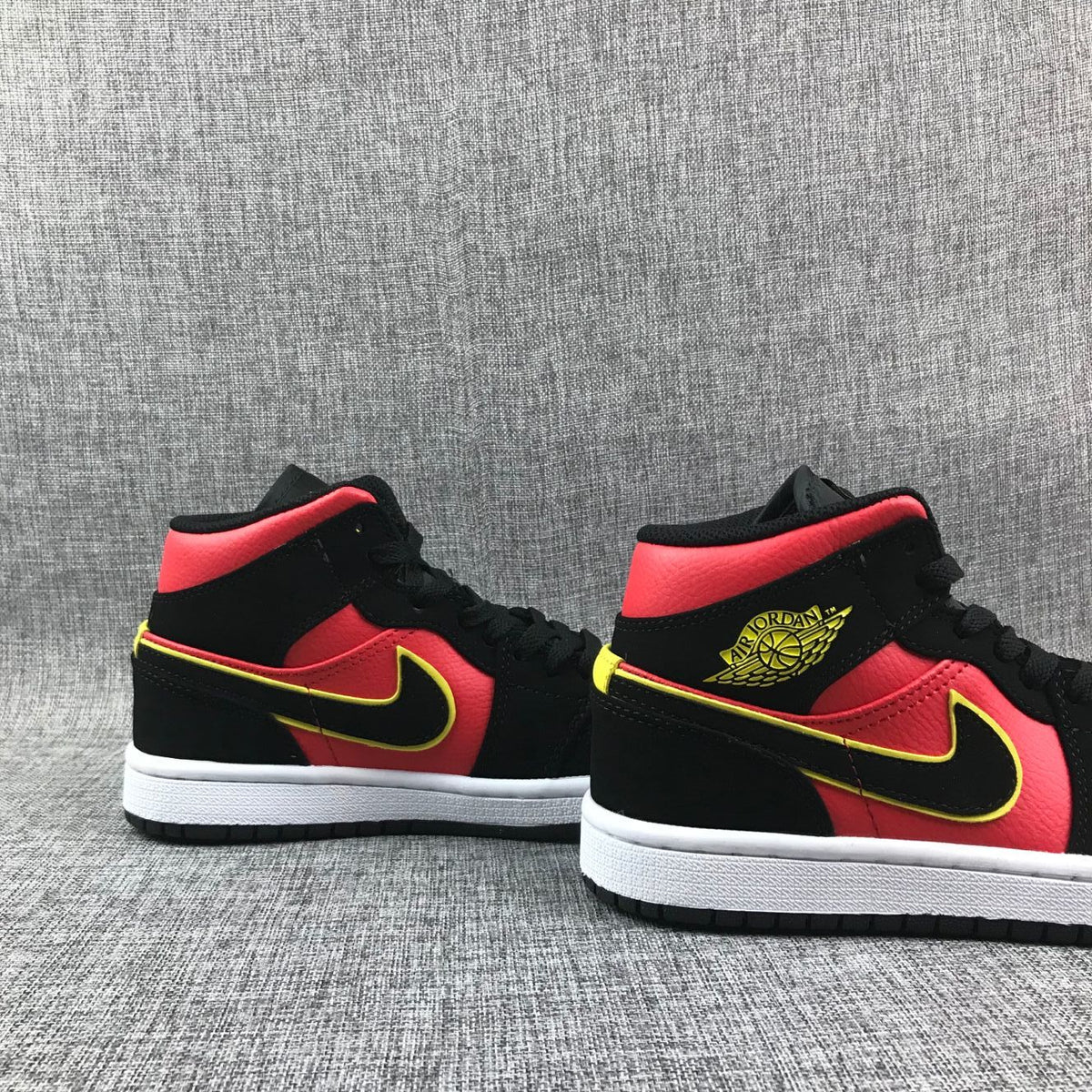 Air Jordan 1 Mid Black, Sneakers in Red and Volt - product image from the listing.
