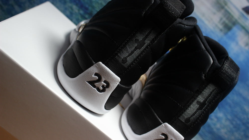 Air Jordan 12 Wings Black White Gold Sneakers 848692-033 - product image from the listing.
