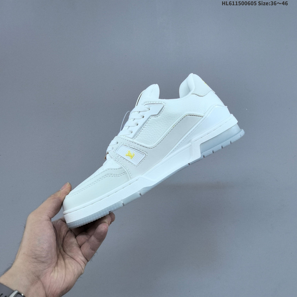 Louis Vuitton Low-Cut Sneakers in White with Floral or Black Trim - product image from the listing.