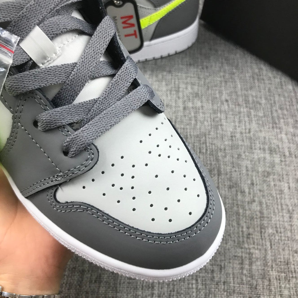 Air Jordan 1 Mid Sneakers in Grey Volt 554724-072 - product image from the listing.
