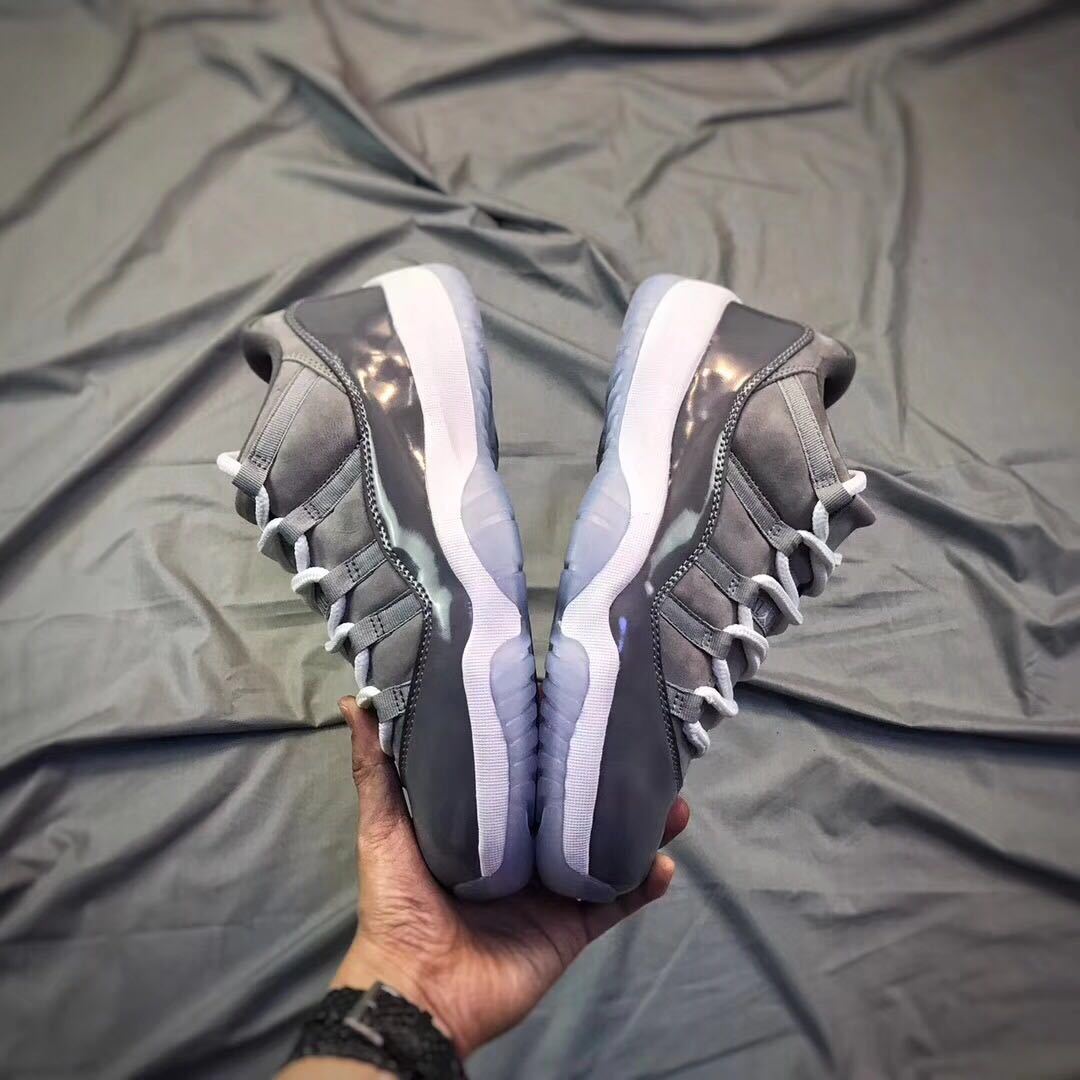 Air Jordan 11 Low Sneakers in Cool Grey - product image from the listing.
