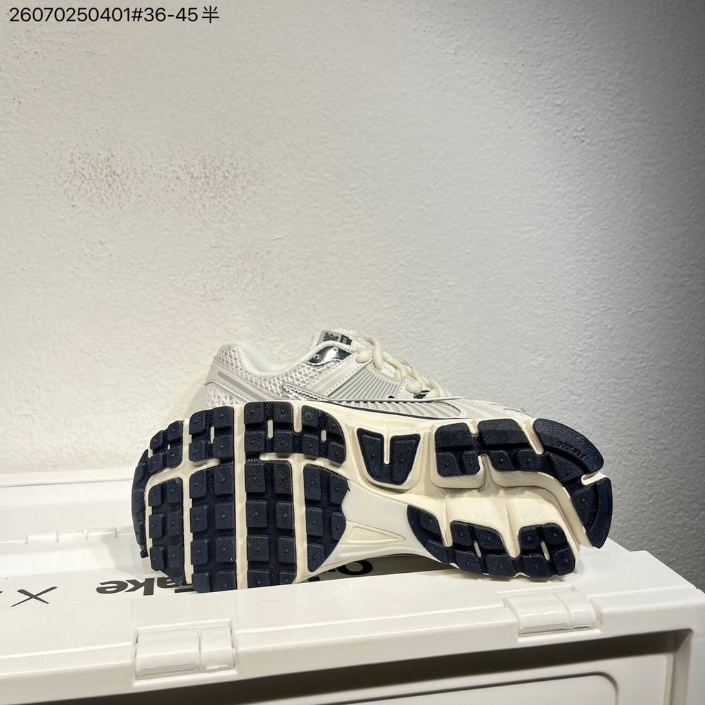 Nike Air Zoom Vomero 5 Sneakers, in White and Black - product image from the listing.