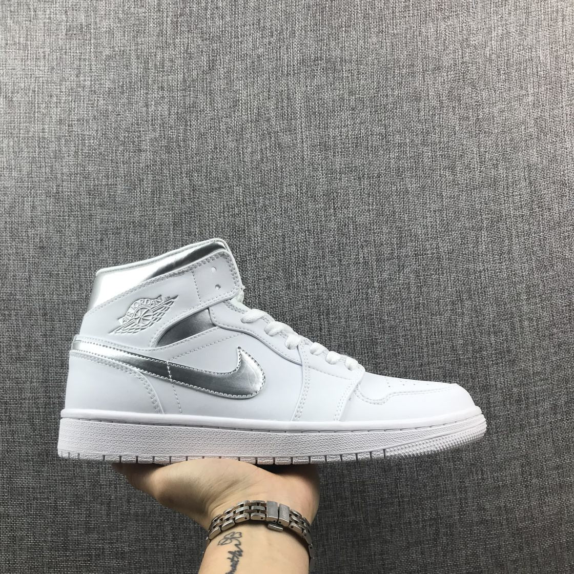 Air Jordan 1 Mid Sneakers in White Silver 554724-105 - product image from the listing.