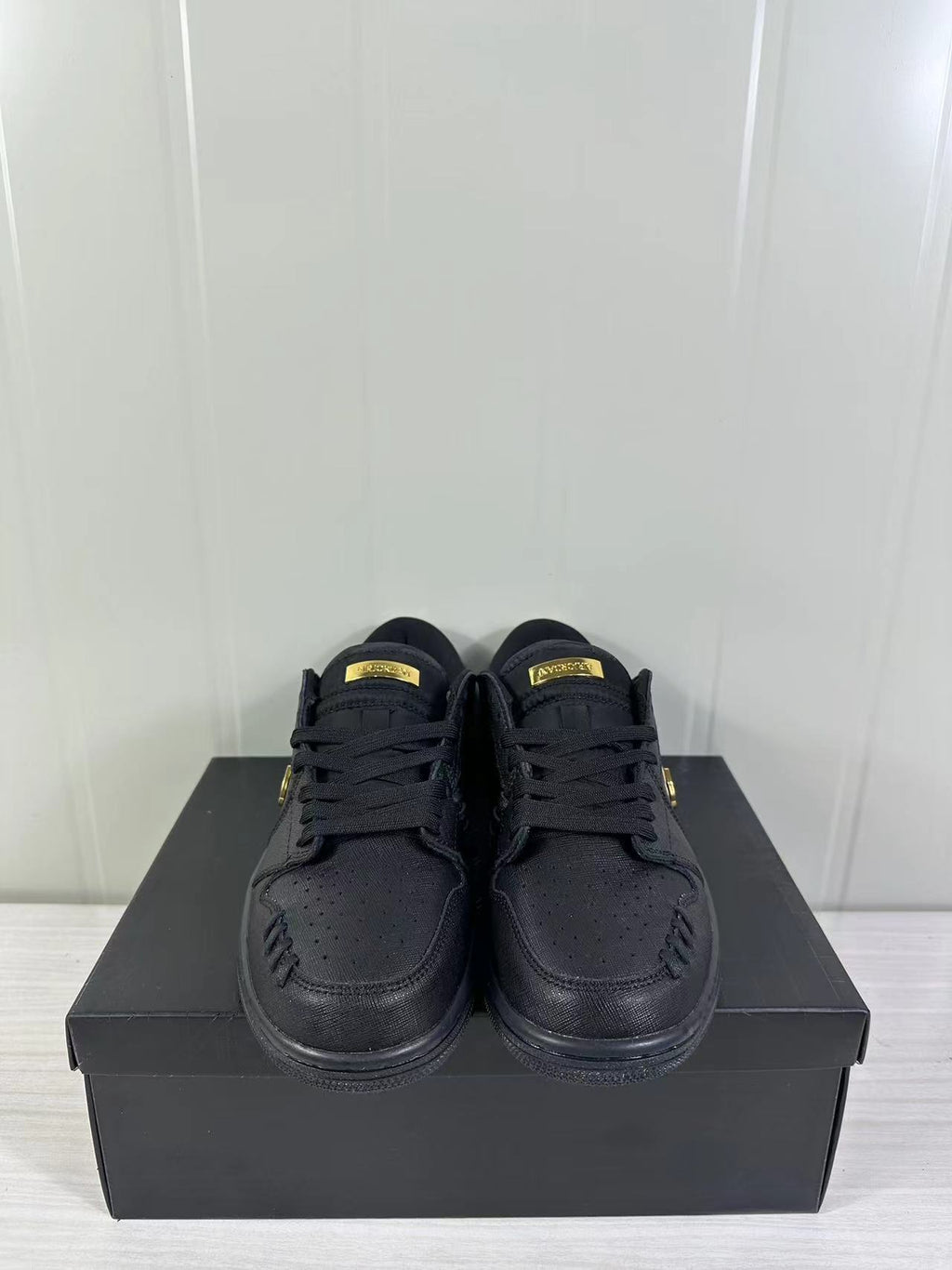 Air Jordan 1 Low Sneakers Black/Gold FN5032-007 - product image from the listing.