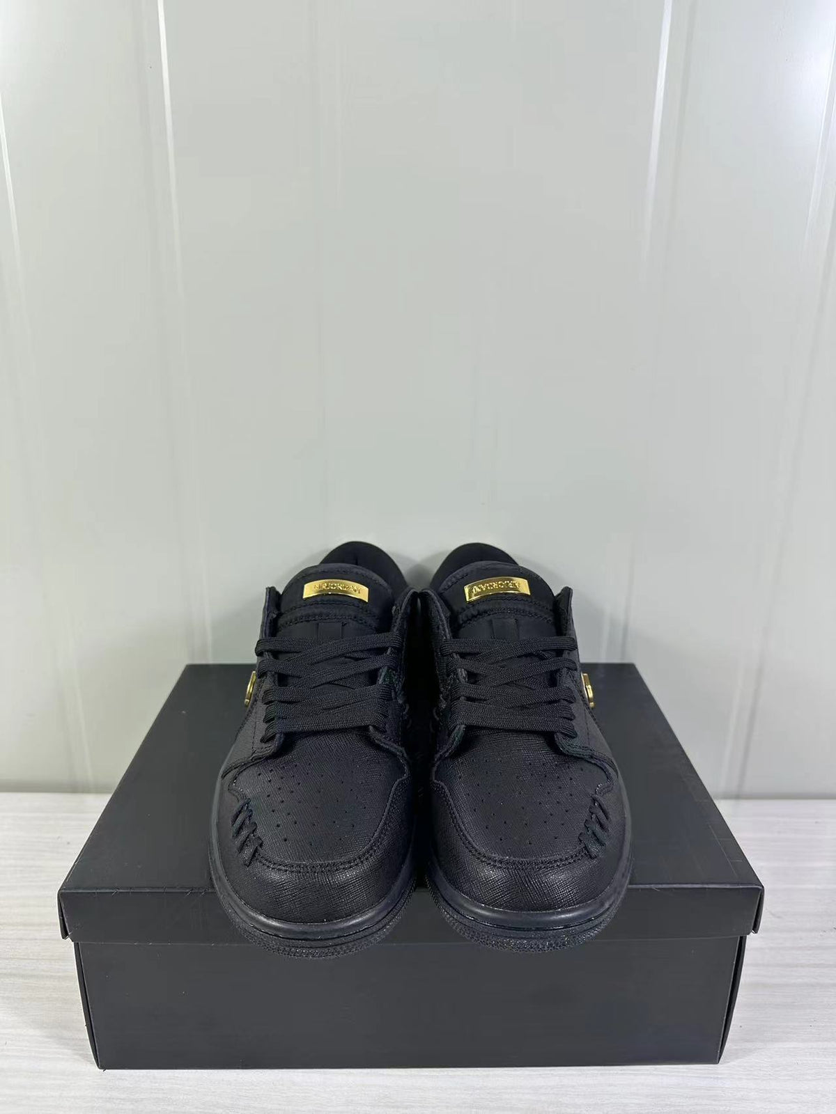 Air Jordan 1 Low Sneakers Black/Gold FN5032-007 - product image from the listing.