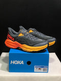 HOKA Speedgoat 5 Trail Running Shoes, in Gray and Orange - product image from the listing.