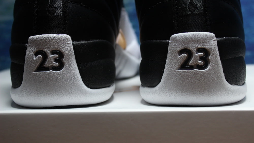 Air Jordan 12 Wings Black White Gold Sneakers 848692-033 - product image from the listing.
