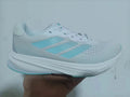 Adidas IG8361 White Shoes for Running with Blue Accents - product image from the listing.