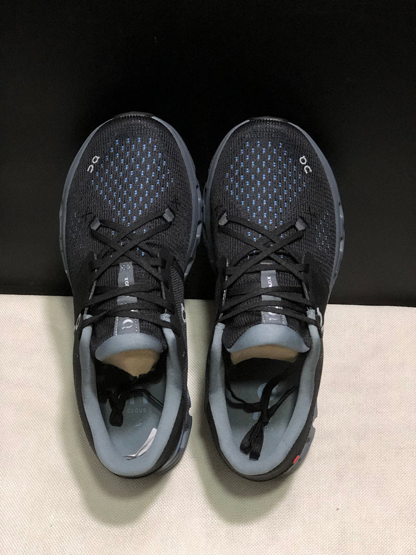 Black and Blue On Cloud X 4 Sneakers - product image from the listing.