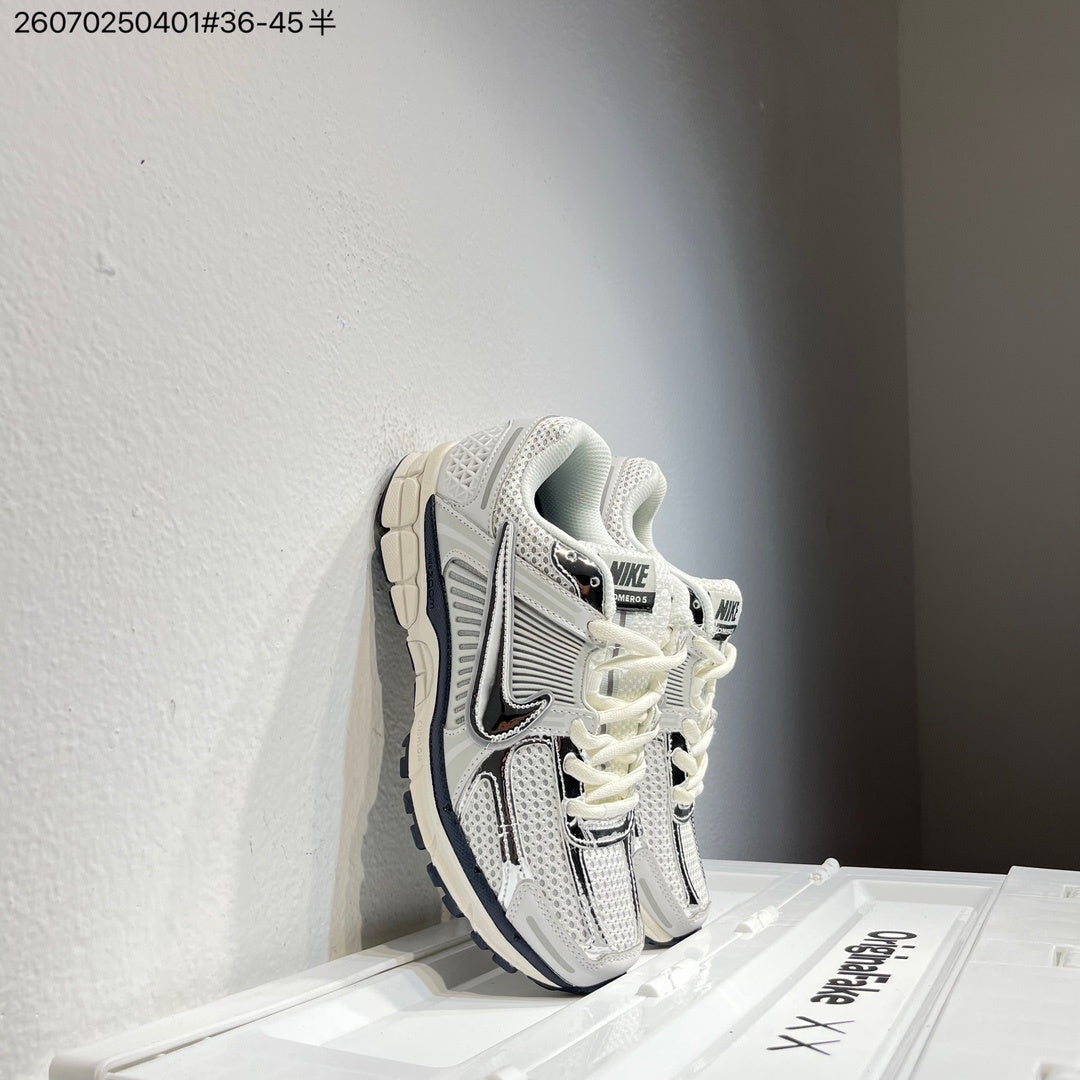 Nike Air Zoom Vomero 5 Sneakers, in White and Black - product image from the listing.