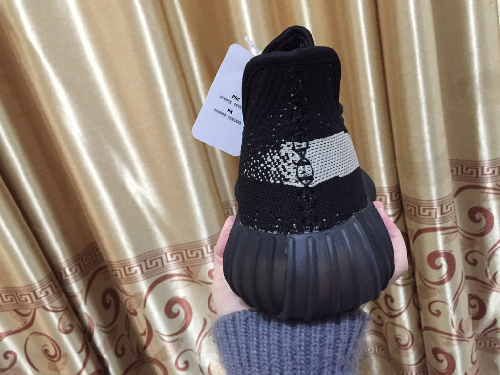 Adidas Yeezy Boost 350 V2 Sneakers in Black White - product image from the listing.