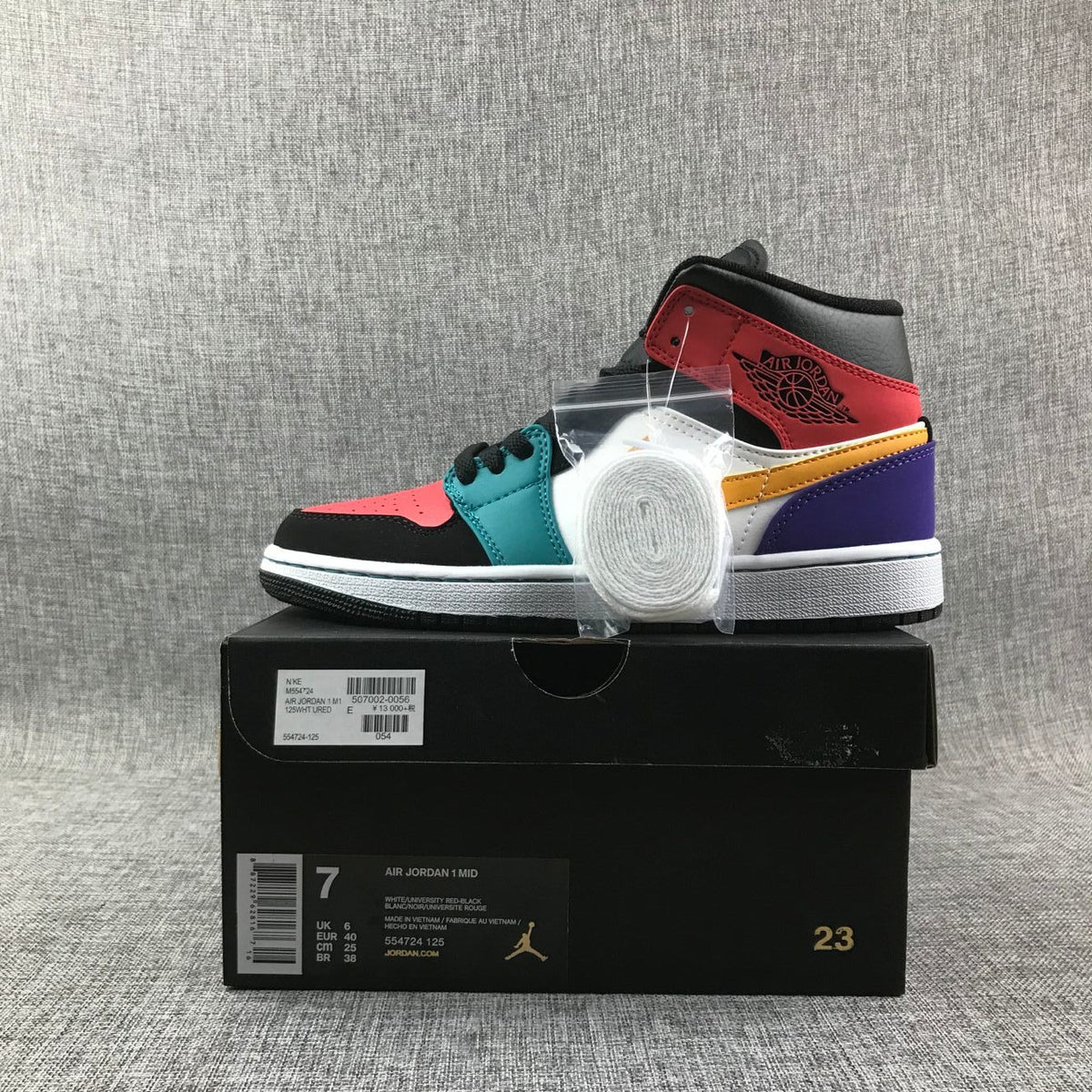 Jordan 1 Mid High-Top Sneakers in Multicolor - product image from the listing.
