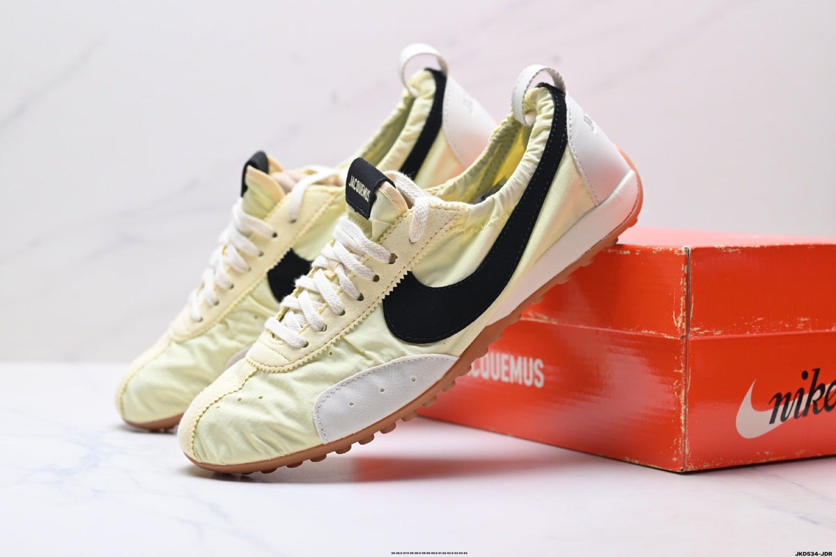 Jacquemus x Nike Jacumoon Sneakers, in Light Yellow and Black - product image from the listing.