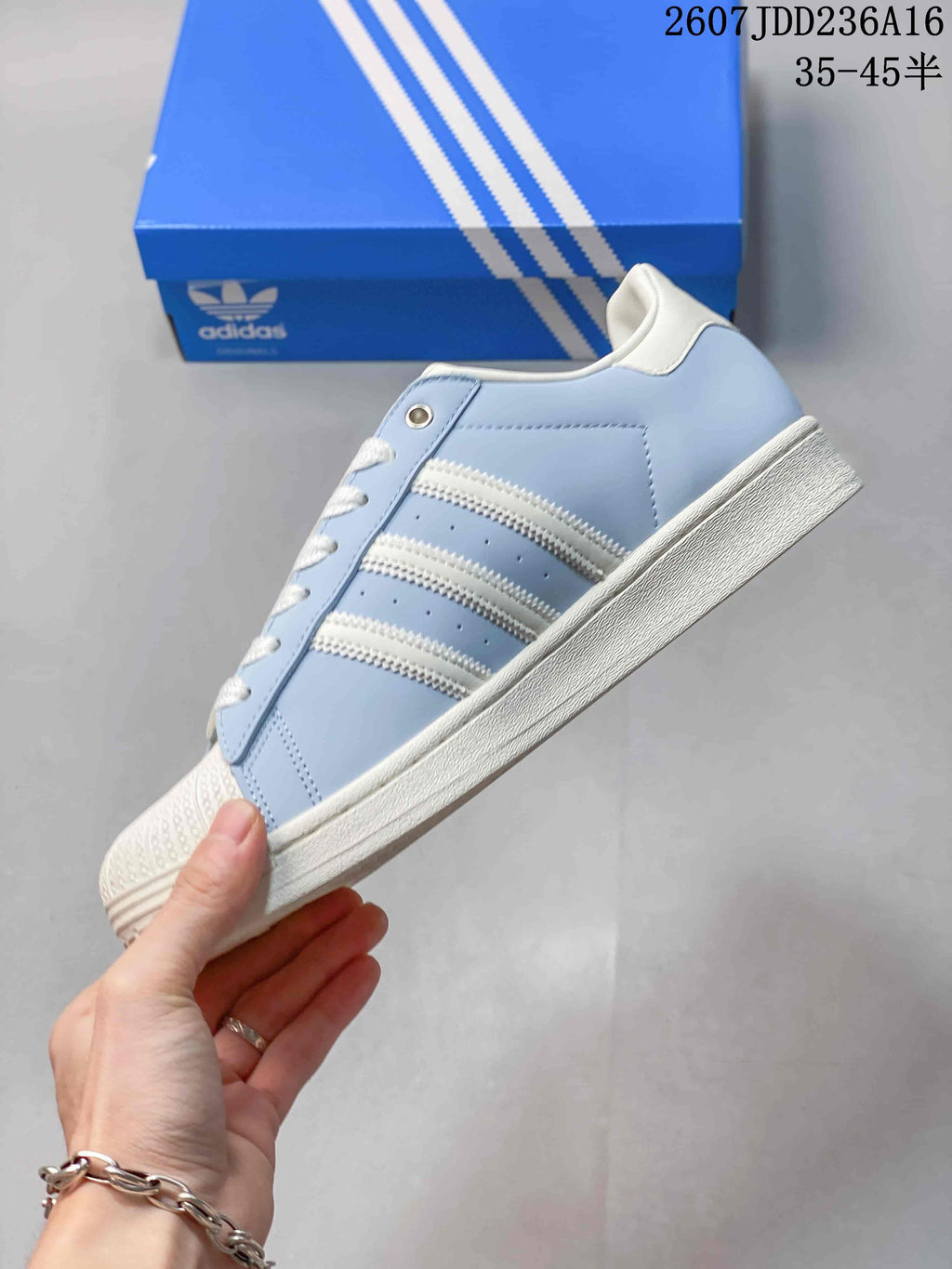 adidas Superstar Sneakers in Light Blue and White JDD236A16 - product image from the listing.