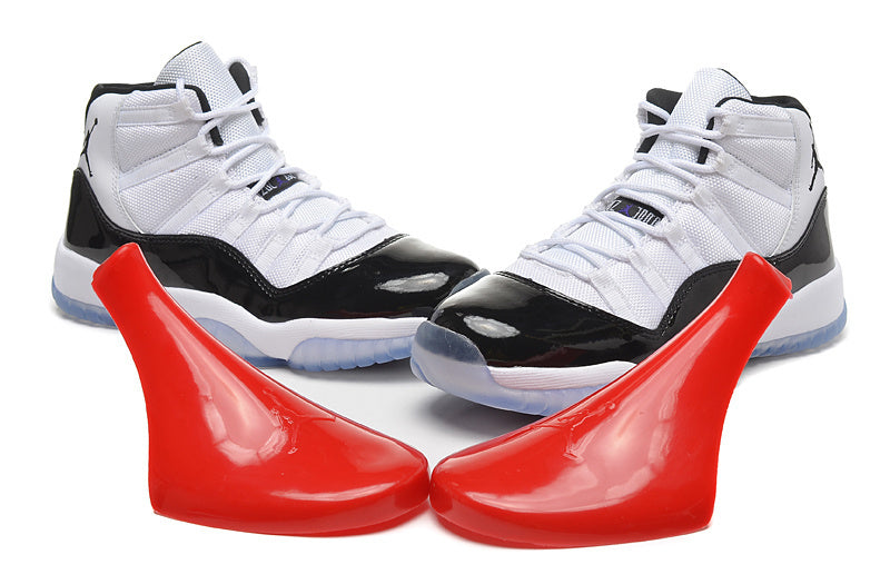 Air Jordan 11 Retro High White and Black Sneakers - product image from the listing.