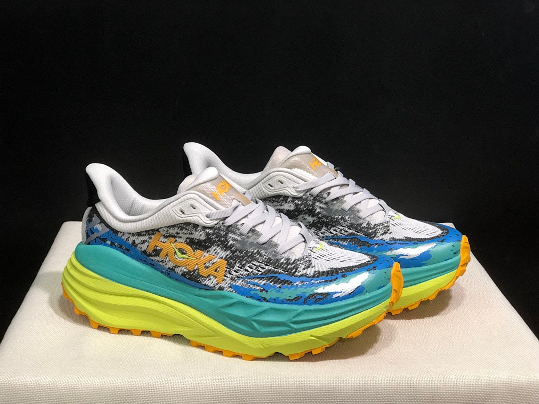 Blue and Lime HOKA Stinson 7 Trail Sneakers - product image from the listing.