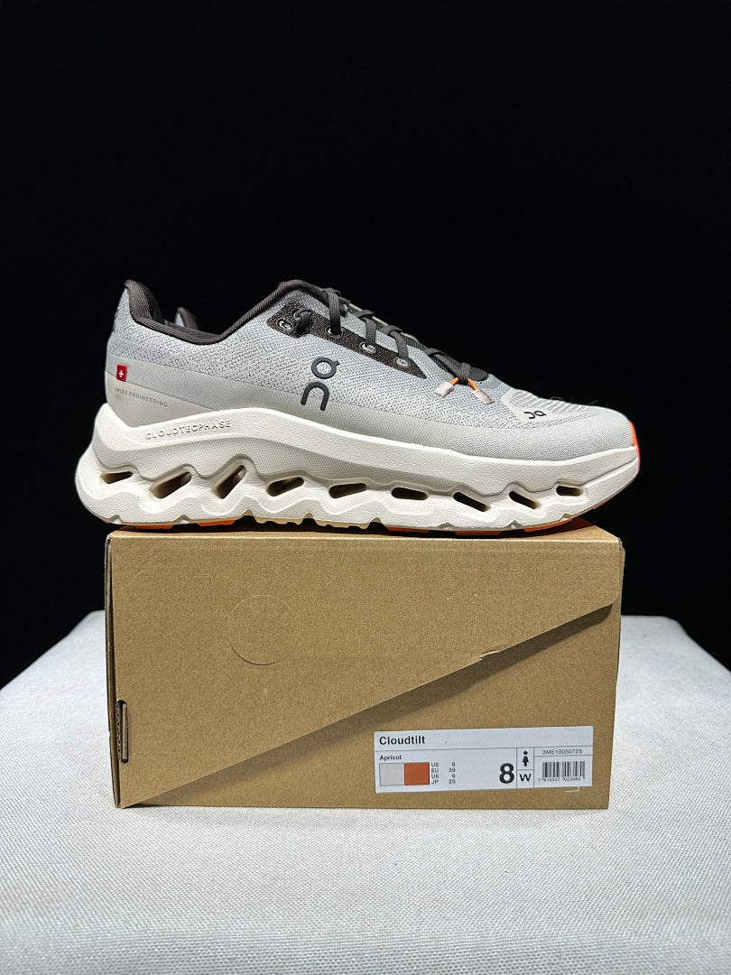 On Cloudtilt Trainers in Gray and Apricot - product image from the listing.