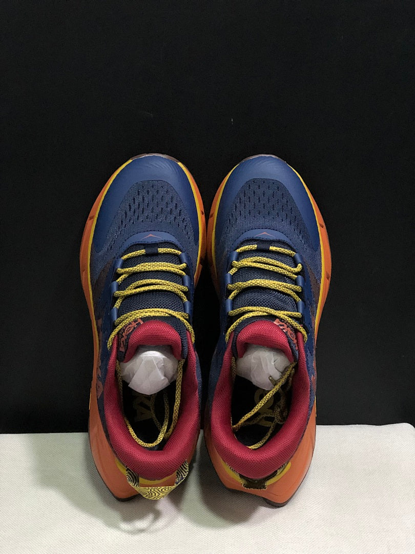HOKA Skyline Float X Trail Sneakers in Navy Orange - product image from the listing.