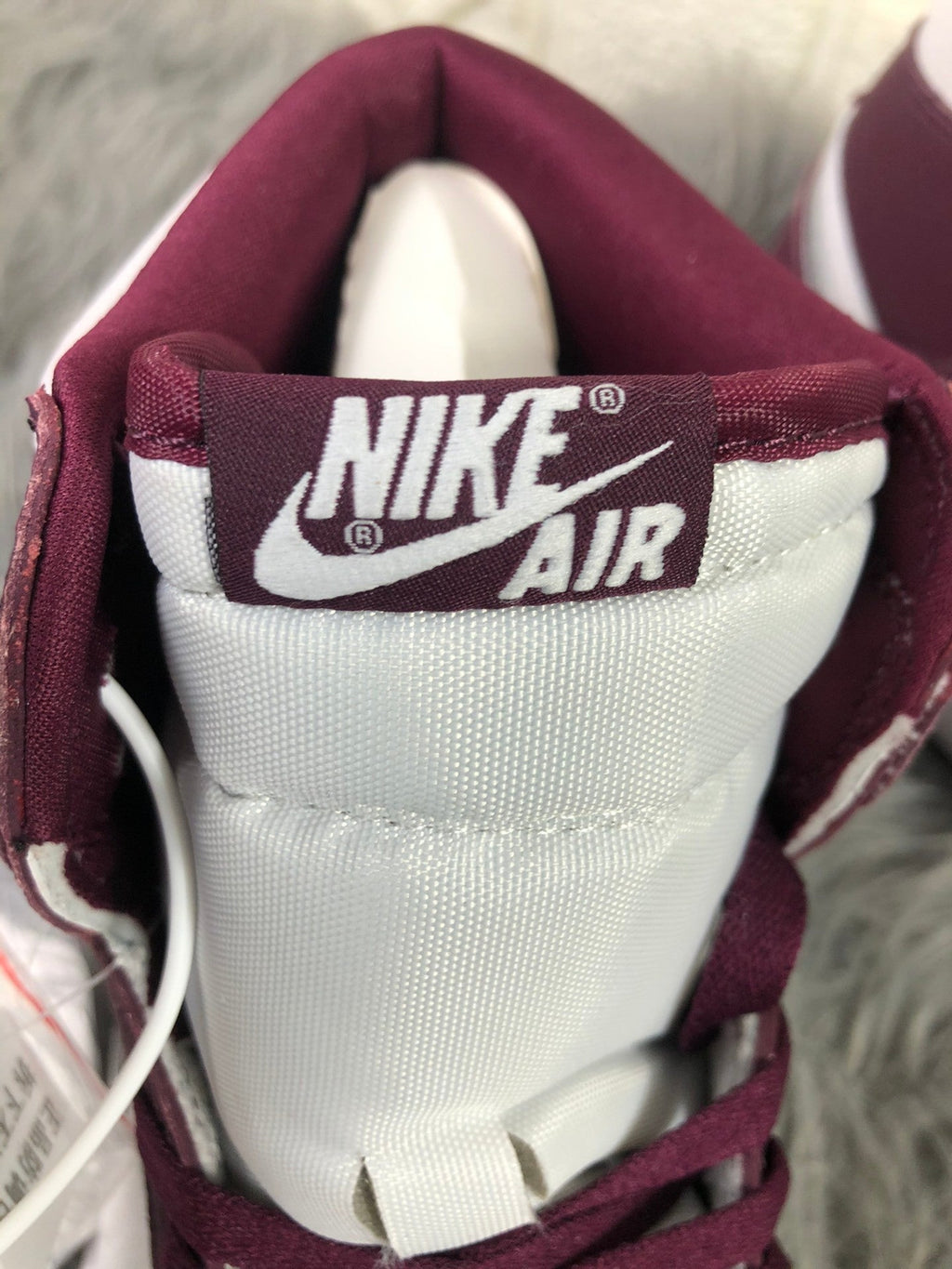 Nike Air Jordan 1 Retro High OG Sneakers in Bordeaux 555088-611 - product image from the listing.