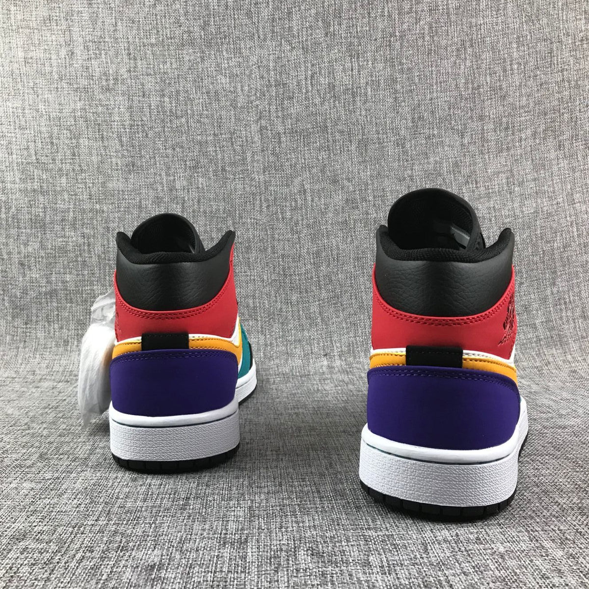Jordan 1 Mid High-Top Sneakers in Multicolor - product image from the listing.