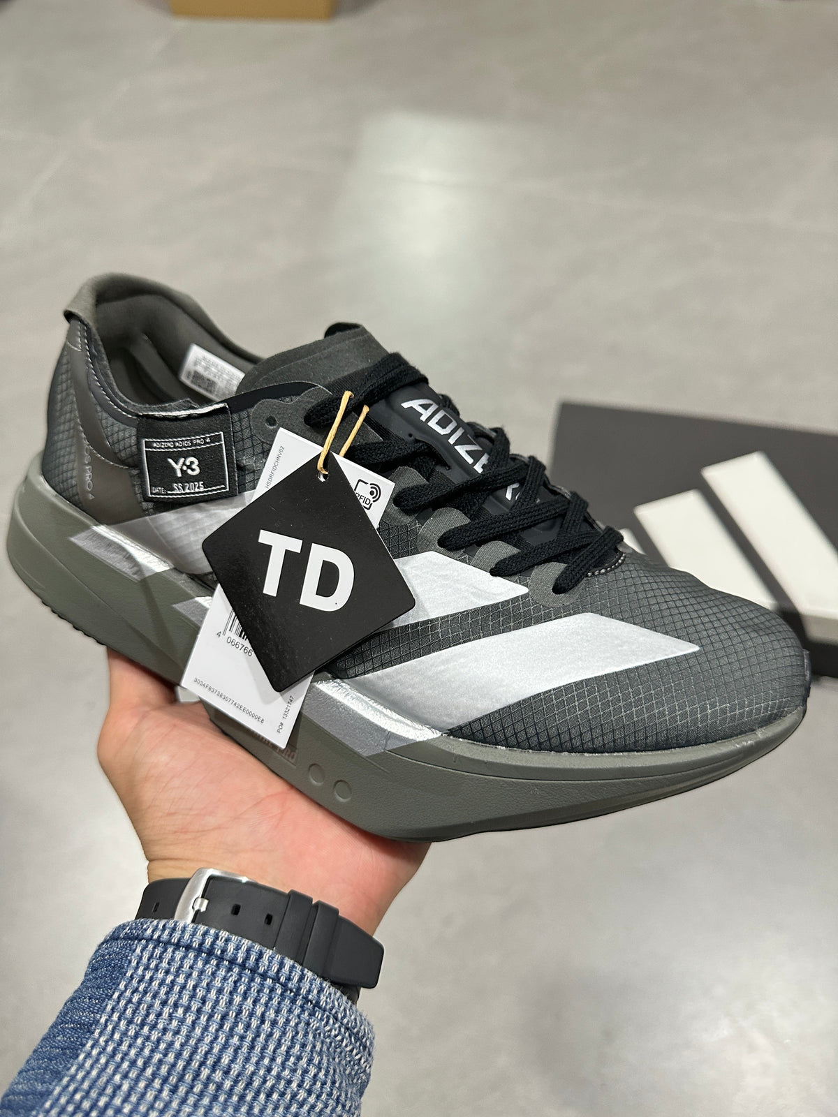 Adidas Adizero Adios Pro 4 Running Shoes in Grey Black - product image from the listing.
