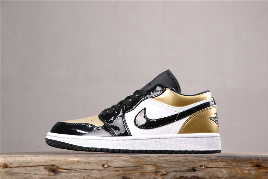 Jordan 1 Low Sneakers in Black Gold CQ9447-700 - product image from the listing.