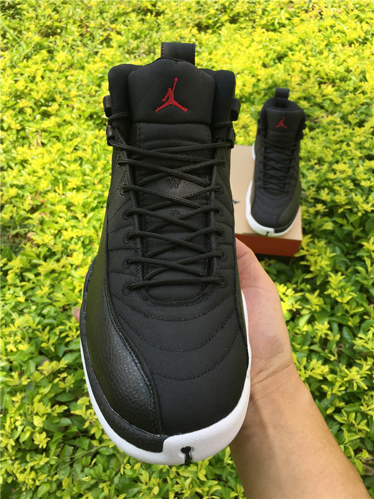 Air Jordan 12 Black Nylon High-Top Sneakers - product image from the listing.