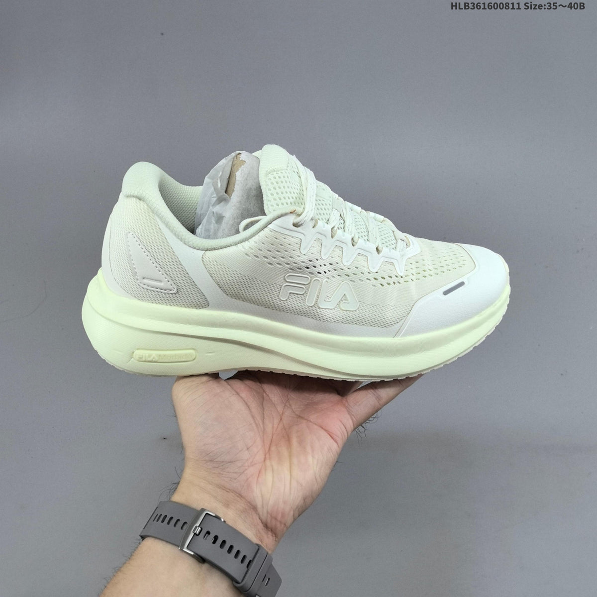 Ivory FILA Pebble Sandal Sneakers - product image from the listing.