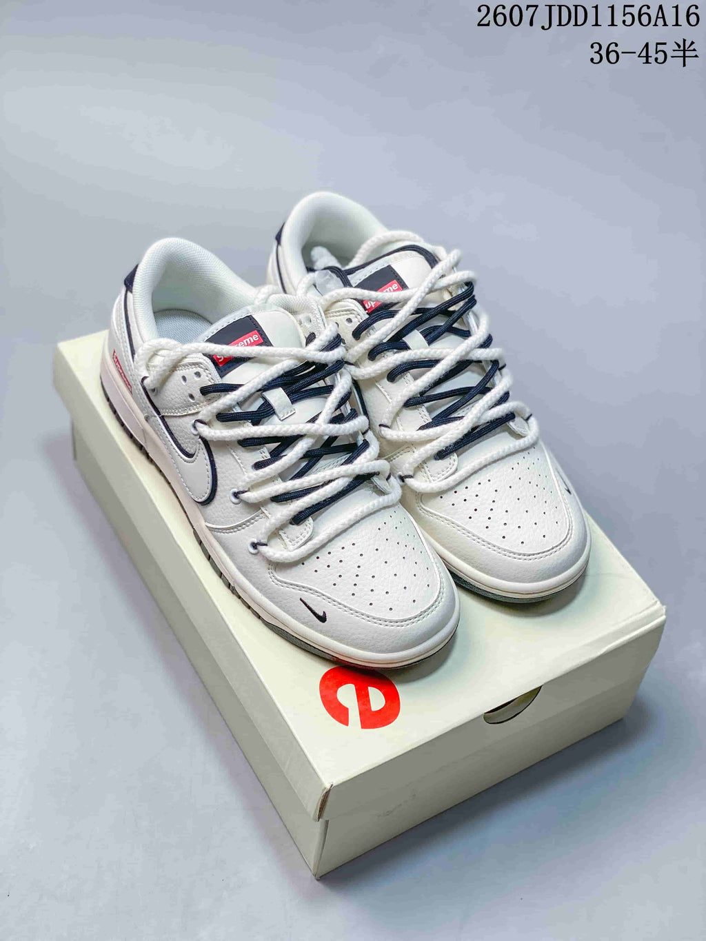 Nike SB Dunk Low Supreme Sneakers in Off-White - product image from the listing.