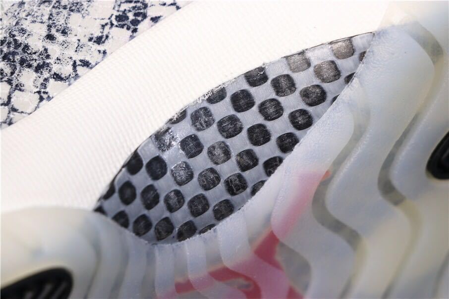 Air Jordan 11 Retro Low White Black Snakeskin Sneakers - product image from the listing.