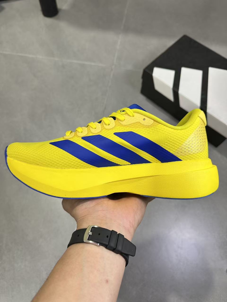 Adidas Lightstrike Pro Running Shoes, in Yellow and Blue - product image from the listing.