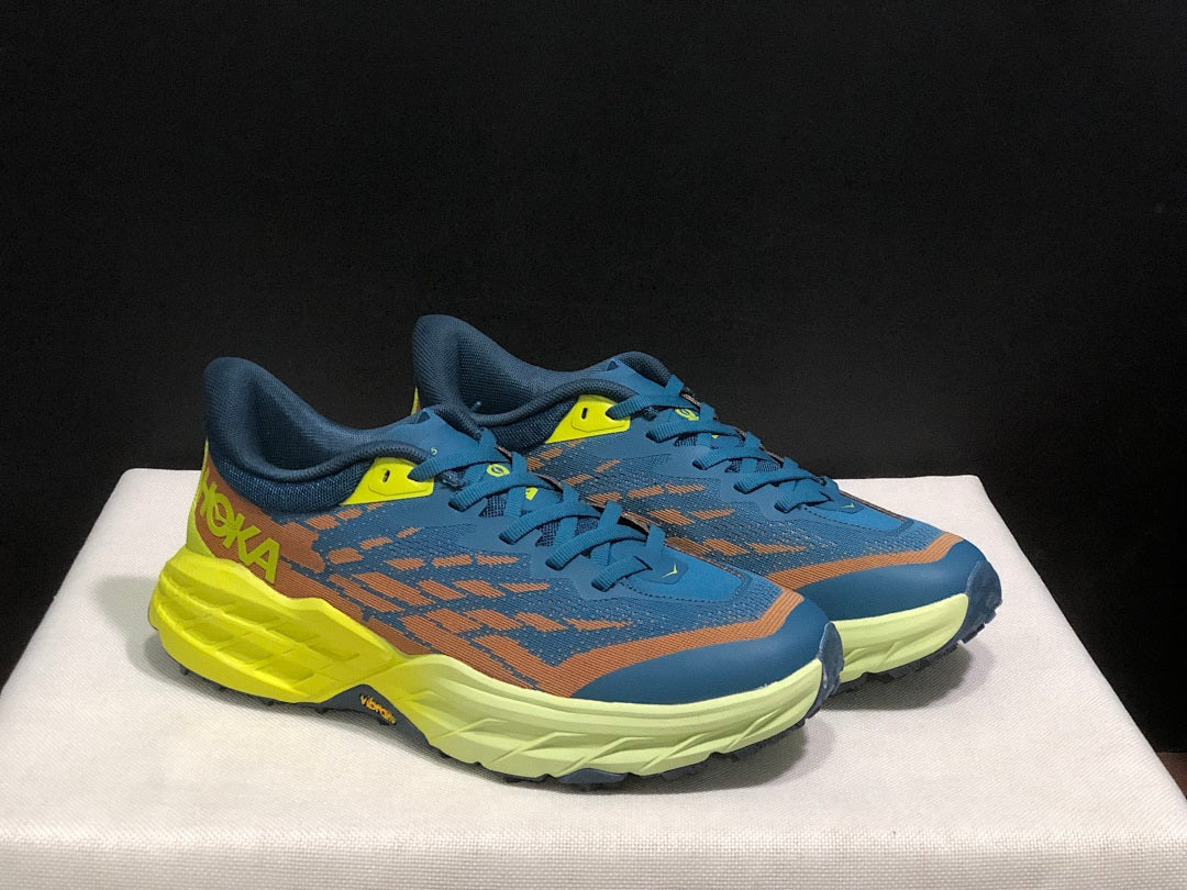 HOKA Speedgoat 6 Trail Running Shoes in Blue Yellow - product image from the listing.