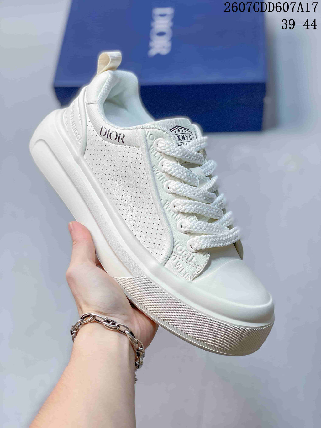 Dior Low-Top Sneakers in White and Navy 2607GDD607A17 - product image from the listing.