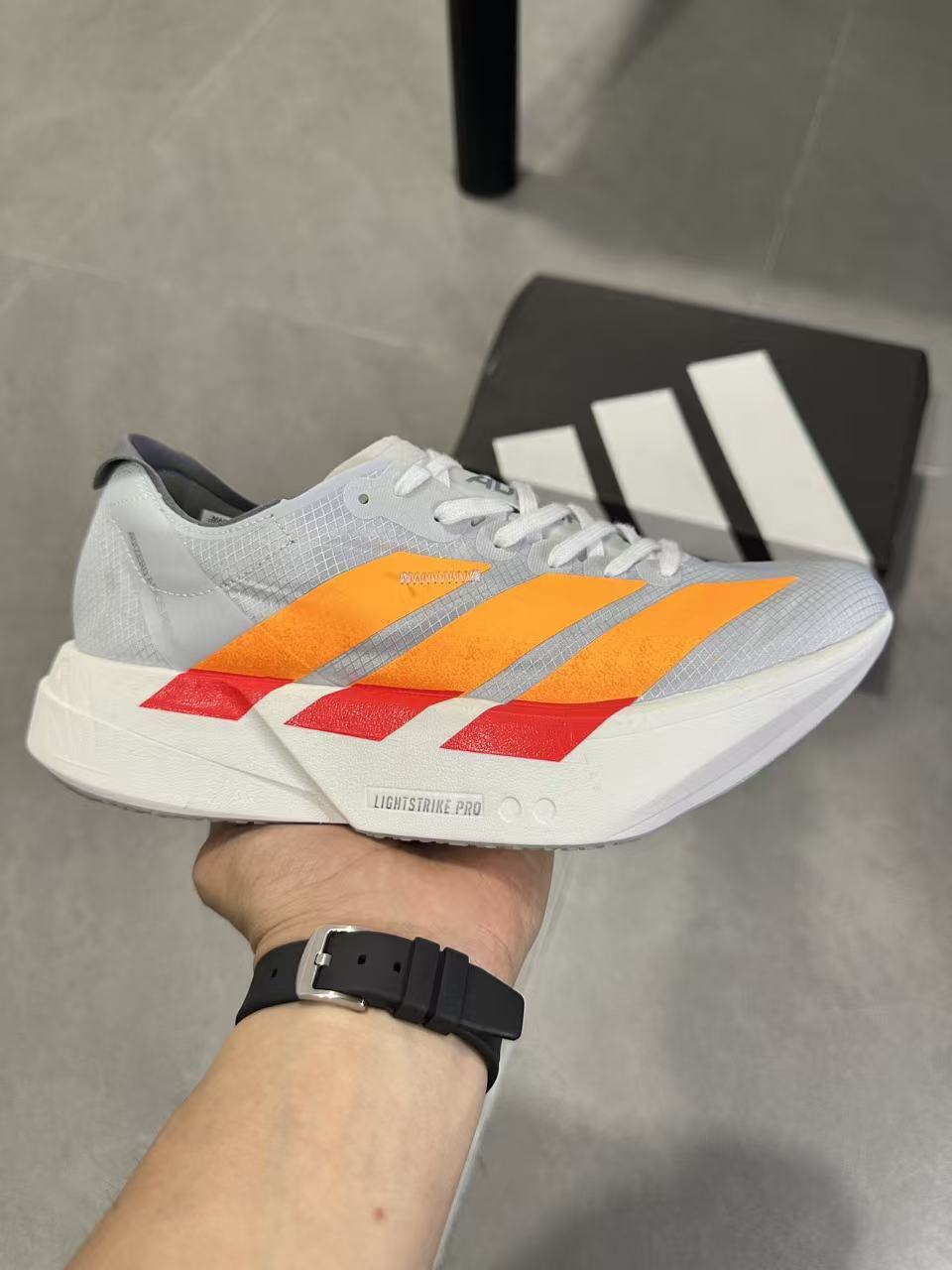 Adidas Adizero Lightstrike Pro Running Shoes in White Orange - product image from the listing.